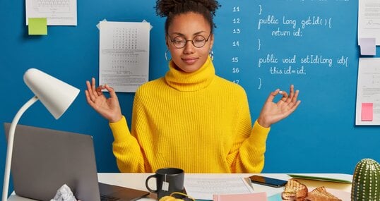 woman freelance worker does yoga in office