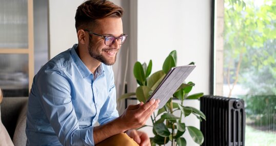 Young Man holding digital tablet