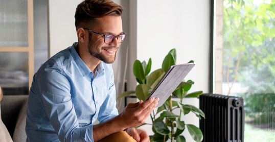 Young Man holding digital tablet