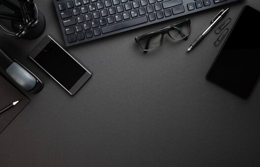 Office Supplies With Computer Keyboard On Gray Desk