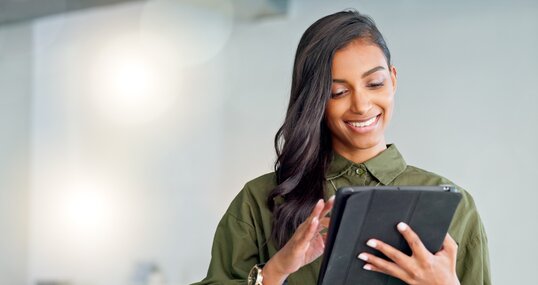 Business woman typing an email, browsing the internet and searching for ideas on a tablet at work. Female corporate professional, expert and designer scrolling on social media or reading a blog